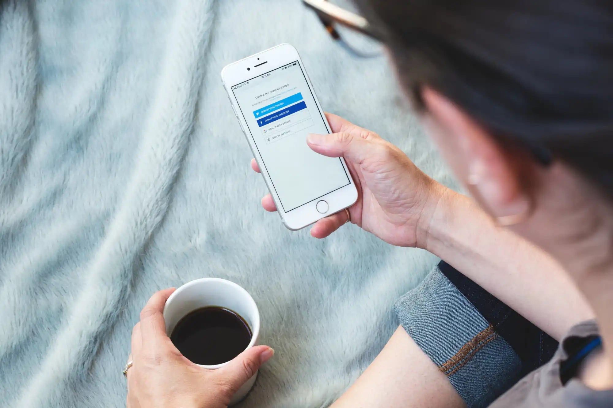 White smartphone with login screen.